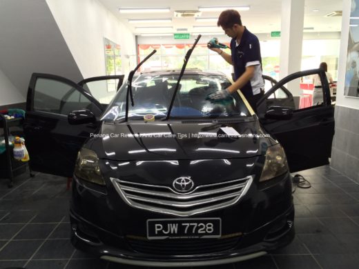 The staffs are installing the Raytech Ultra 70 on the Toyota Vios GT Street Windscreen