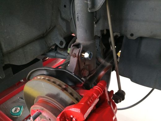 Location of adjustable camber bolt is installed